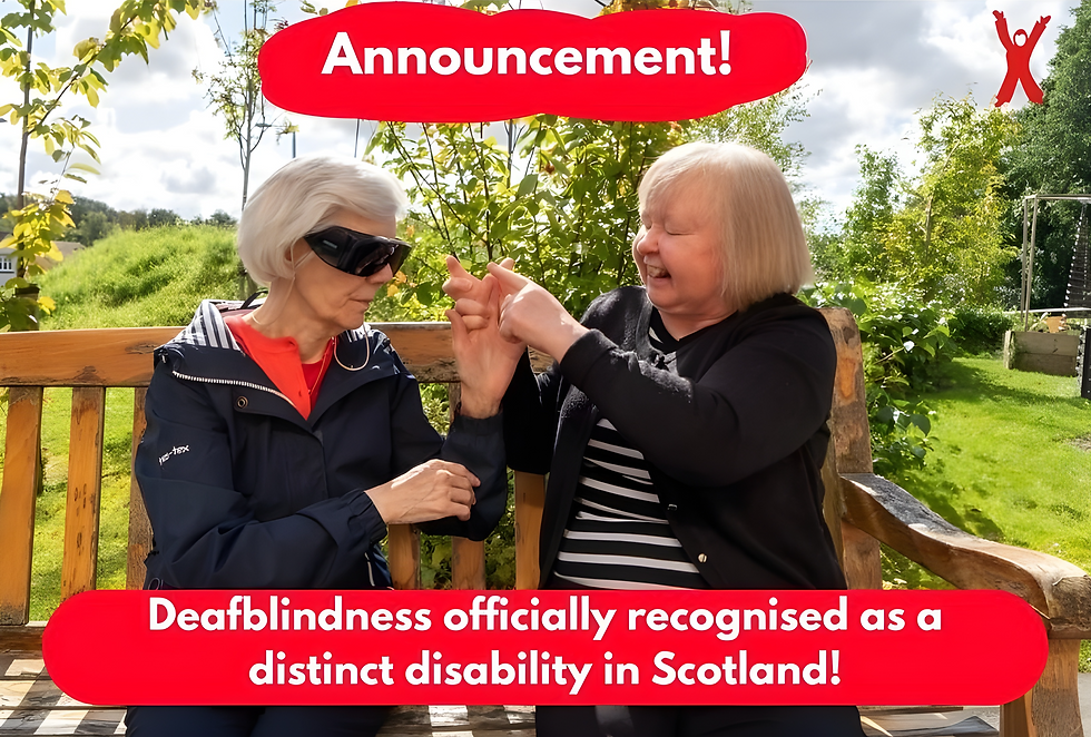 Two deafblind people sitting on a bench tactile signing. Caption reads "Announcement! Deafblindness officially recognised as a distinct disability in Scotland!"