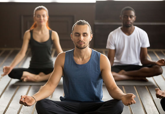 group-young-sporty-people-sitting-sukhasana-exercise.jpg