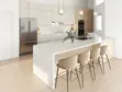 Modern Hamptons kitchen with German cabinetry, full-height pantry wall, quartz countertops, and family seating peninsula. Cabinetry costs approximately $45,000–$55,000, with total displayed kitchen package costs ranging from $82,000–$92,000.