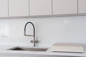 Sleek Kitchen with simple kitchen faucet.