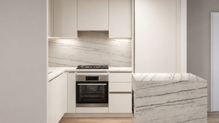 Modern small NYC apartment kitchen with island featuring Ballerina German cabinets, LeMans corner storage, quartz countertops, and space-saving appliance planning with kitchen cabinetry costs from $24K–$28K.