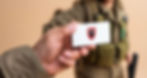 IDF soldier handing a blank business card_1.jpg