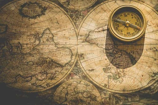 christmas game for hermitcraft fans: guess the hermit. this is a picture of an old world map and an old compass to complete the aesthetics