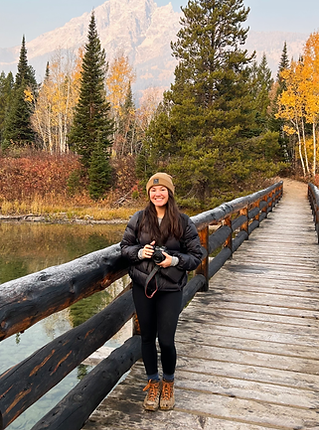 photographer in front of mountains