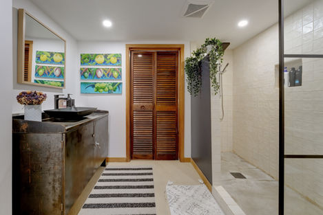 a bathroom with a sink and a striped rug