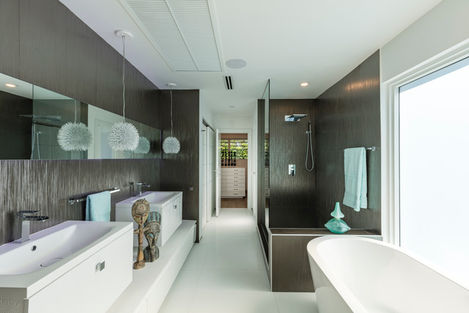 a bathroom with a bathtub and a walk in shower