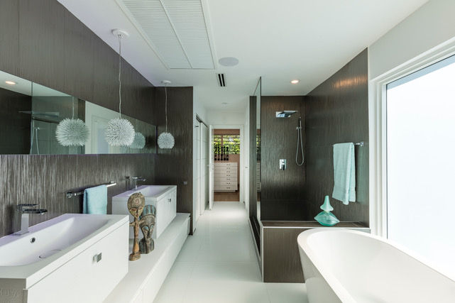a bathroom with a bathtub and a walk in shower
