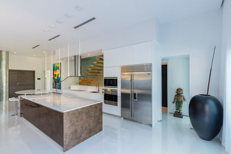 a kitchen with stainless steel appliances and a large island