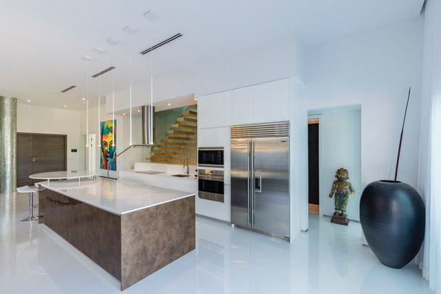 a kitchen with stainless steel appliances and a large island