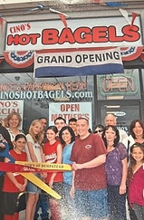Cino's Grand Opening in 2010 with Joe, Jr. cutting the tape and his friends and family behind him, standing in front of the restaurant.
