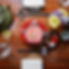 Dining table set with Japanese dishes, teapot, and flowers