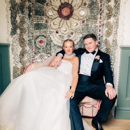 Bride and Groom relaxing after the reception on the shell alcove love seat at Kin House