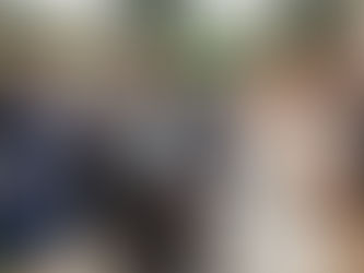 Bride and Groom in confetti throw line outside the Pear Tree at Purton with pale pink and peach bridal bouquet by Corky and Prince.