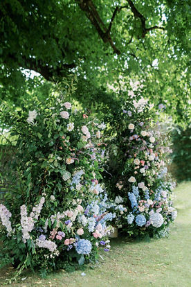 Broken floral arch for an outdoor wedding on the lawn at Hamswell House near Bath