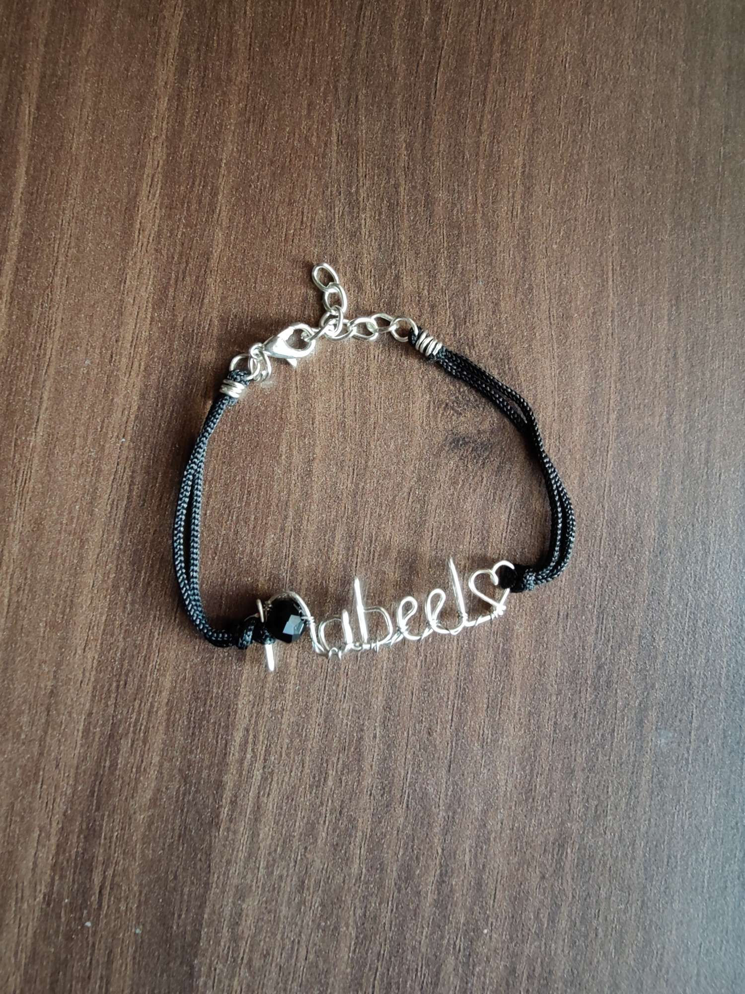 Name pendant silver bracelet in black cords