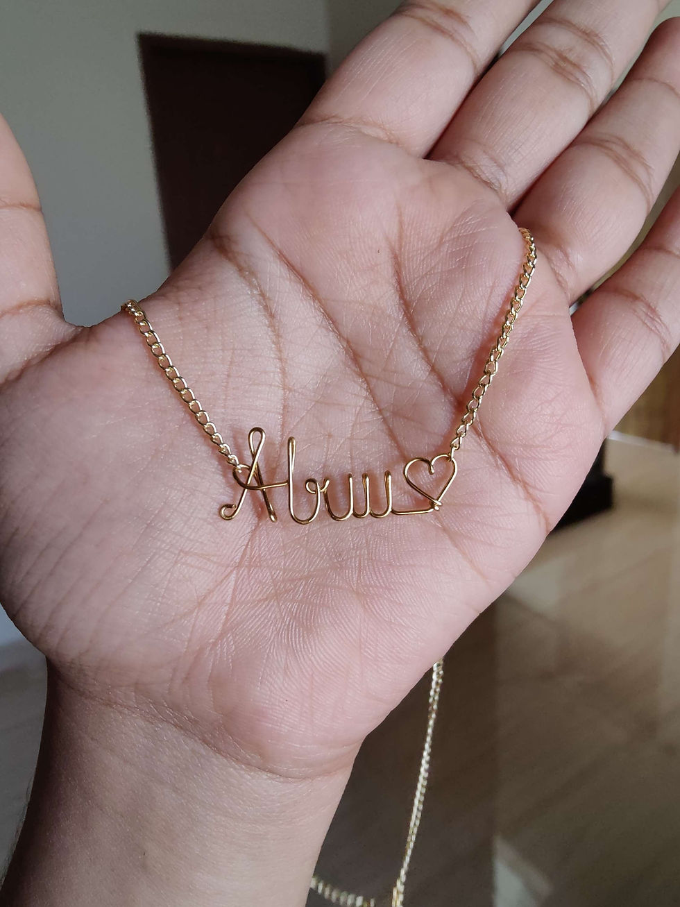 Thumbnail: Name pendant chain with a heart in gold 
