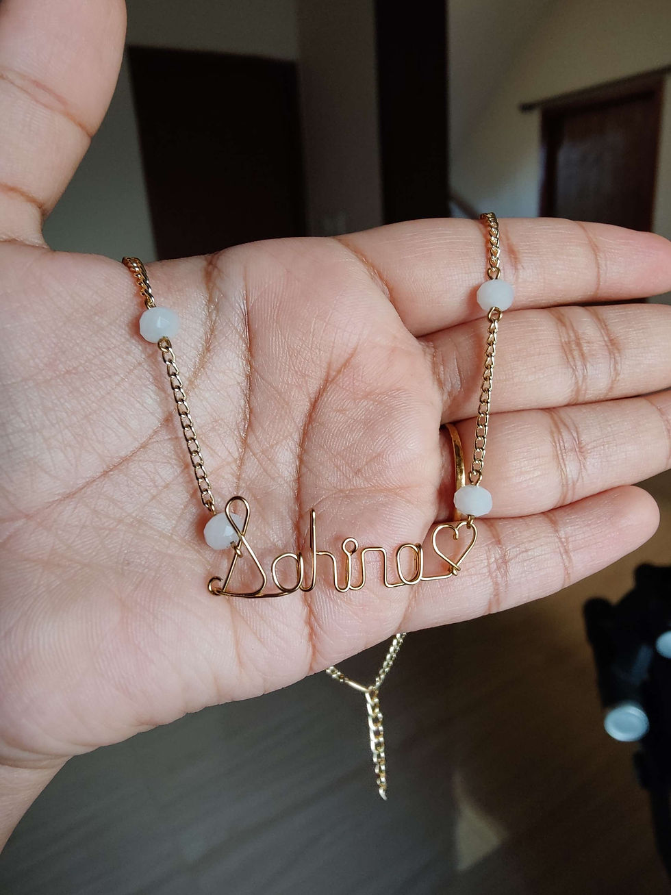 Thumbnail: Name pendant chain with opaque white crystals on chain in gold