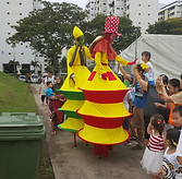 Stilt walker carnival costume fringe activity roving talent entertainment best singapore kids birthday party corporate event company