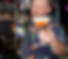 Bartender giving cheers with drink