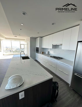 Calgary kitchen remodeling project with island and white cabinets.