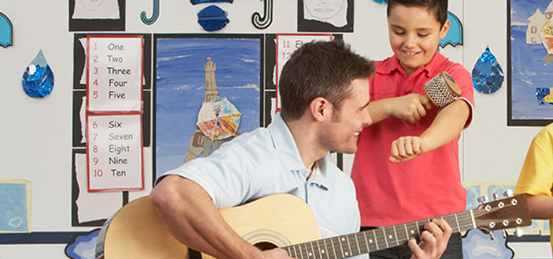 Male Teacher Playing Guitar