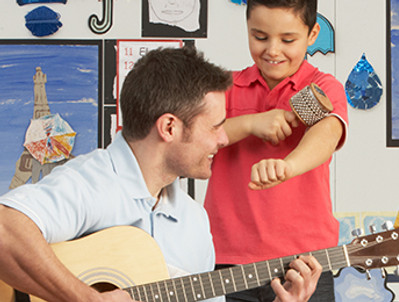 Male Teacher Playing Guitar