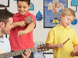 Male Teacher Playing Guitar