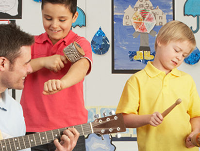 Male Teacher Playing Guitar