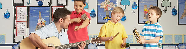 Male Teacher Playing Guitar