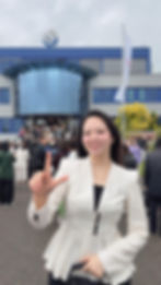 Woman in front of FitLine Premium Cellular Nutrition Malaysia headquarters