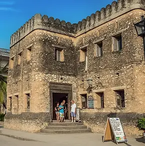 Tourist-visiting-the-Old-Fort-in-Stone-Town-Zanzibar.webp