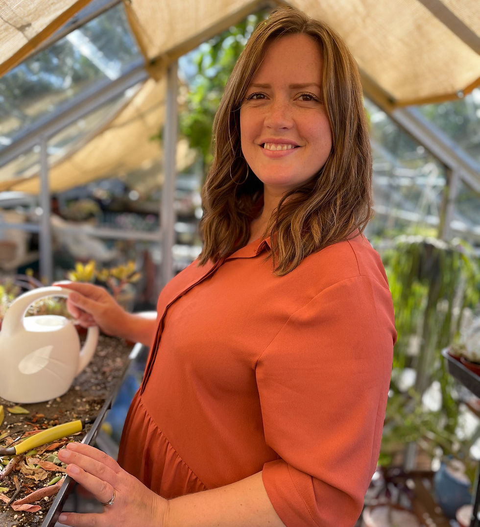 Happily tending to my succulents in my favourite place - the greenhouse. This photo was taken by Jordan back in 2021 when I was about 5 months pregnant with our second son.