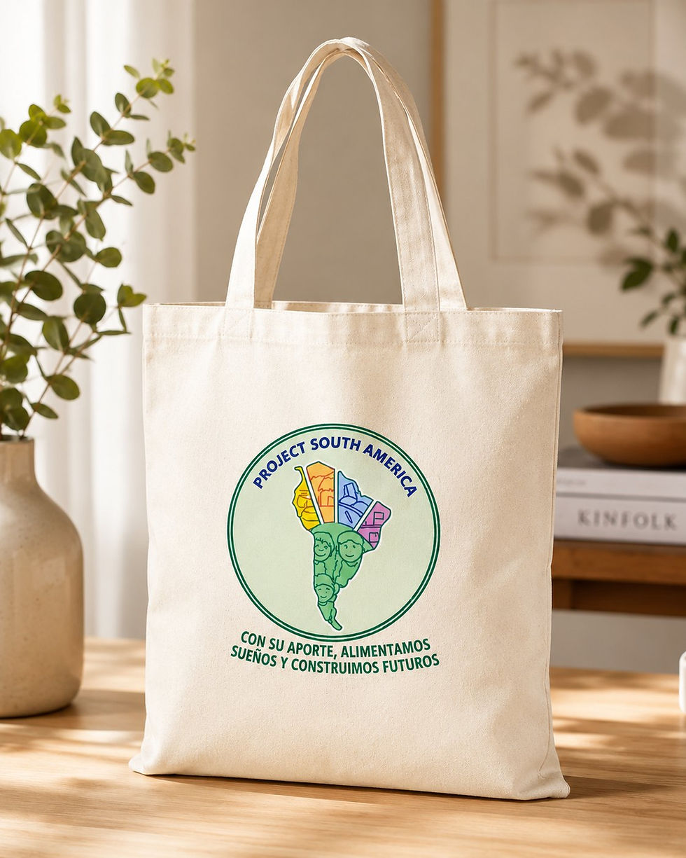 Project South America tote bag with the logo and tagline, on a wooden table
