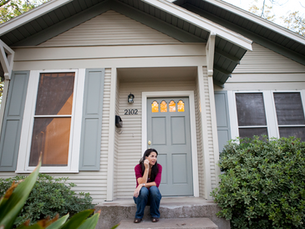 Blair Burton sitting on the front steps of her South Congress bungalow in Austin, Texas, where Blair Burton Interiors first began.