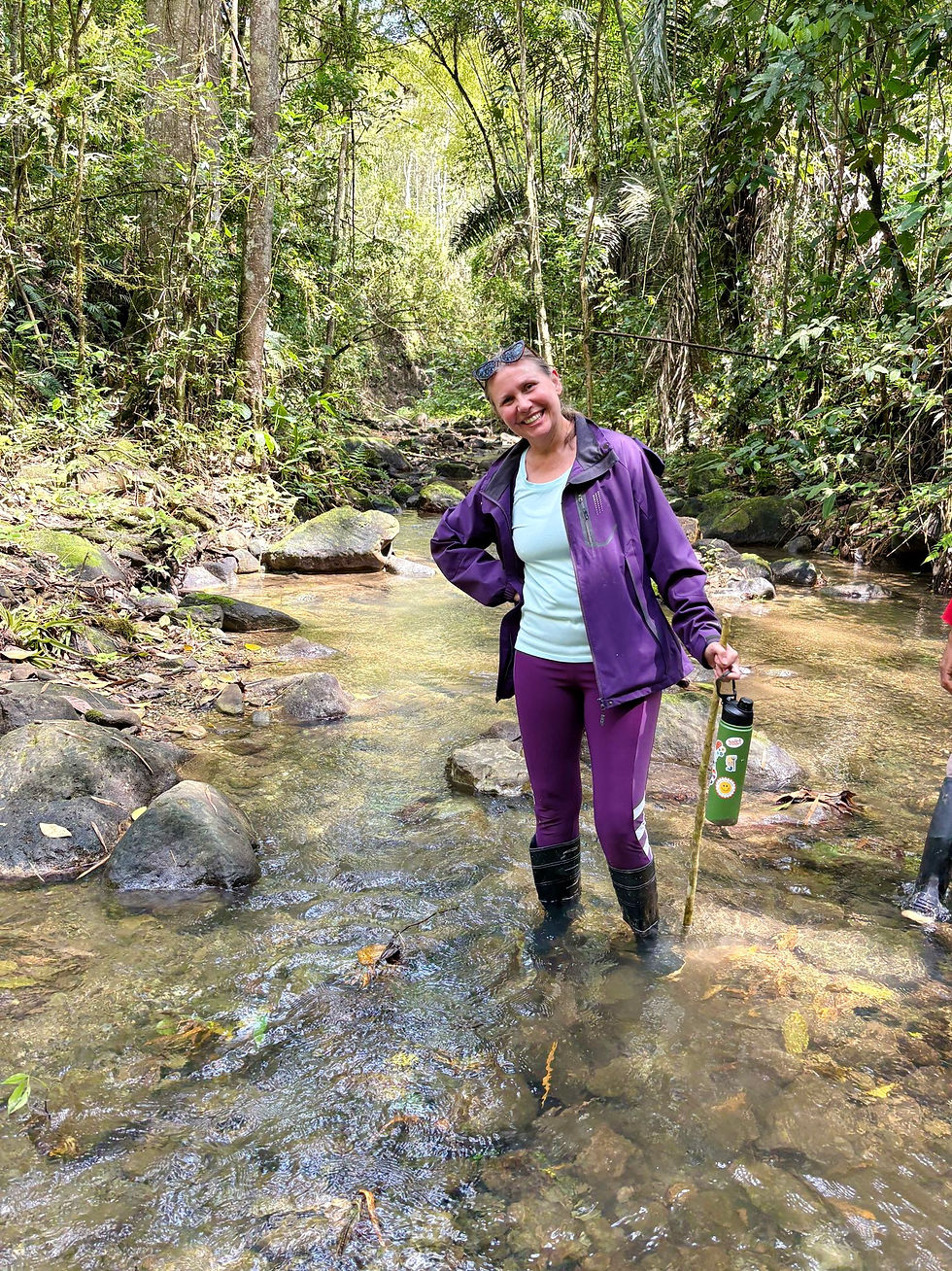 Woman standing in a stream