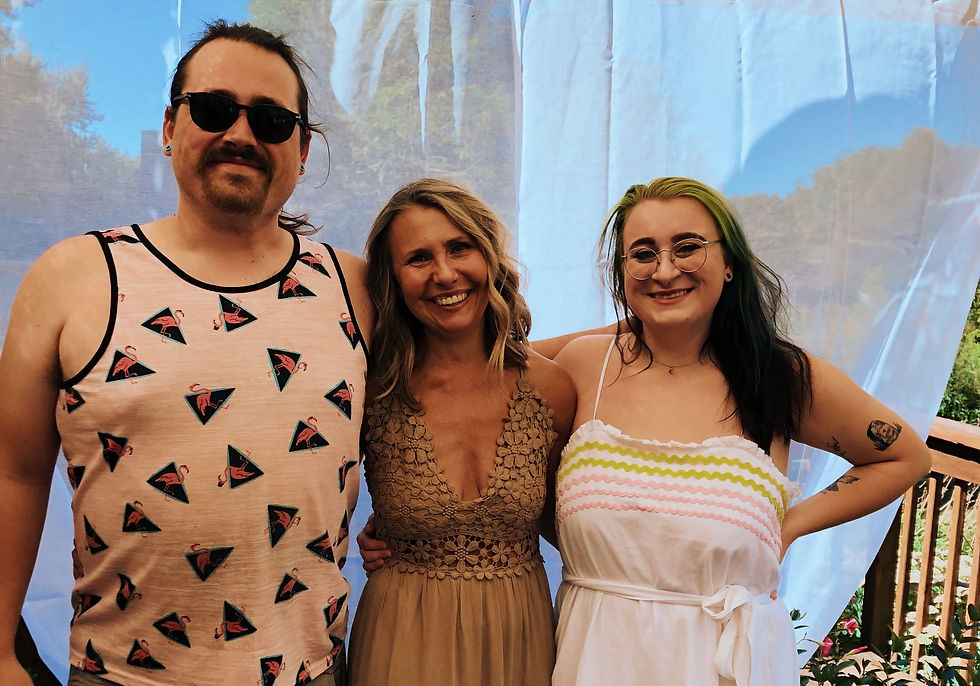 Three people holding one another