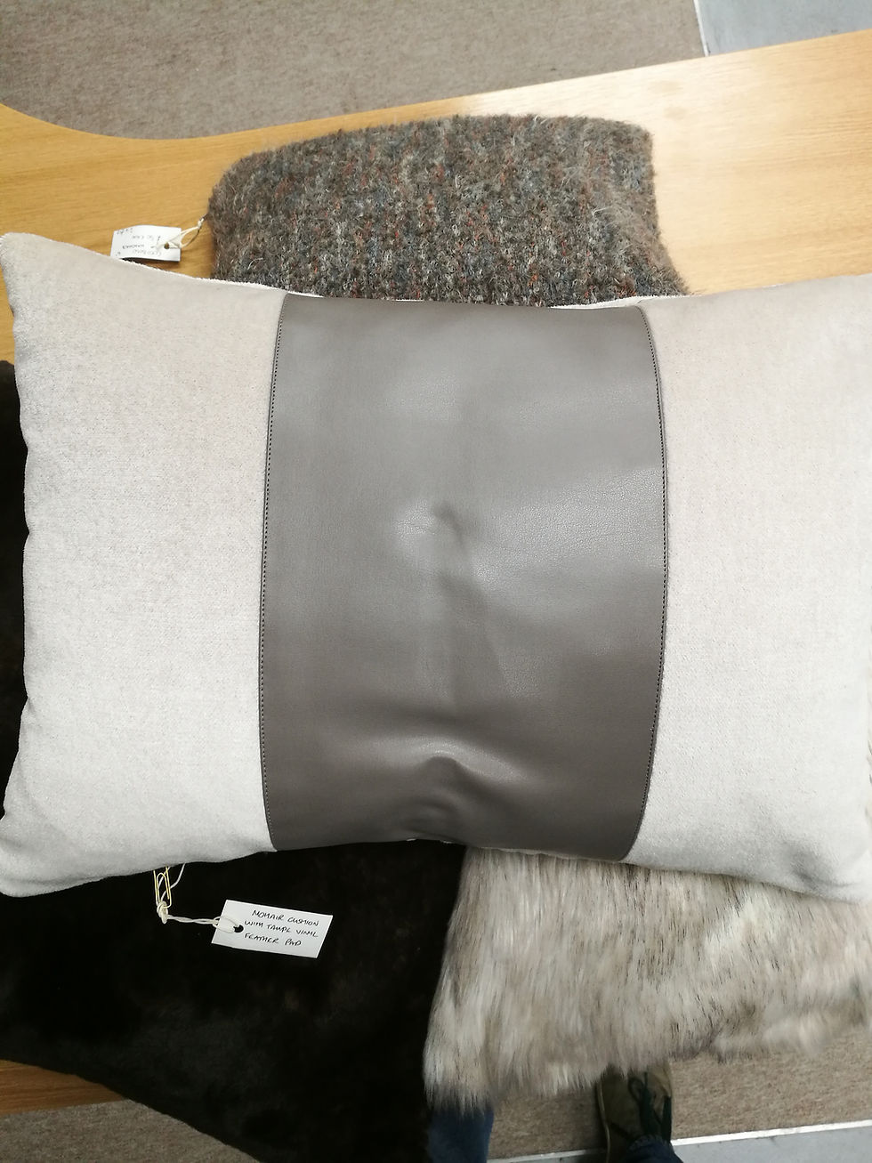 Thumbnail: Light tan rectangular mohair cushion with a taupe vinyl band