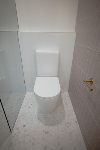 Luxury bathroom flooring featuring marshmallow terrazzo tiles