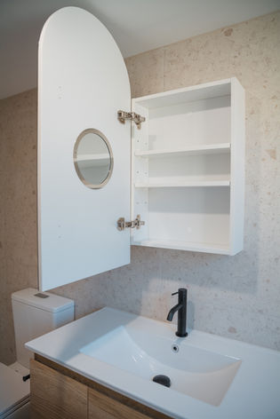 Arched mirror cabinet and terrazzo tiles in Gold Coast bathroom renovation