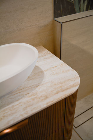 High-end spa-inspired bathroom Gold Coast with bespoke fluted wooden vanity and marble benchtop
