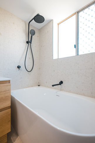 Free standing bath with matte black taps