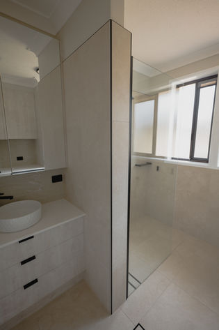 Tweed Heads bathroom renovation styled with monochromatic neutral tones and clean architectural lines