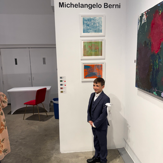 Visitor standing near Michelangelo Berni’s exhibition wall inside the gallery