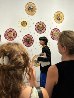 Guests looking at Katherine Miranda's booth.