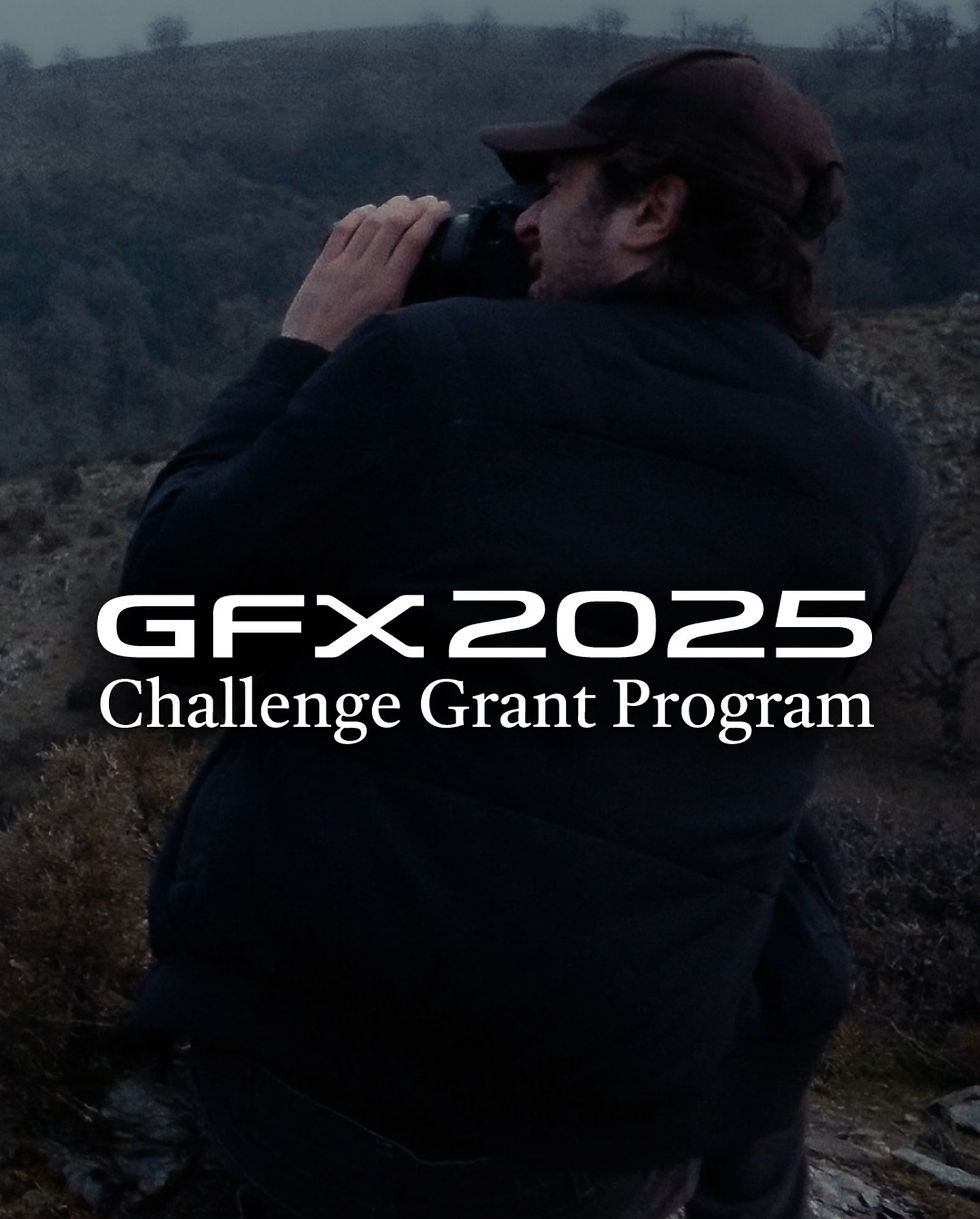 A person with a cap uses a camera in a hilly landscape at dusk. Text reads "GFX 2025 Challenge Grant Program."