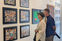 Visitors at clio art fair at the artist booth