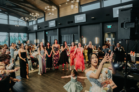 Crowded dance floor with guests celebrating at modern Calgary venue