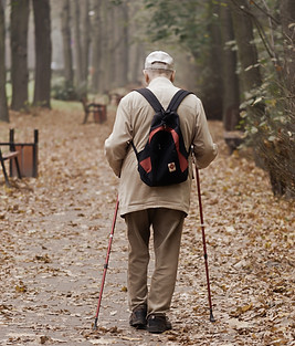 man-carrying-backpack-while-walking-on-a