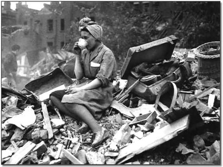 Woman calmly drinking tea during the London Blitz air raid in World War II.