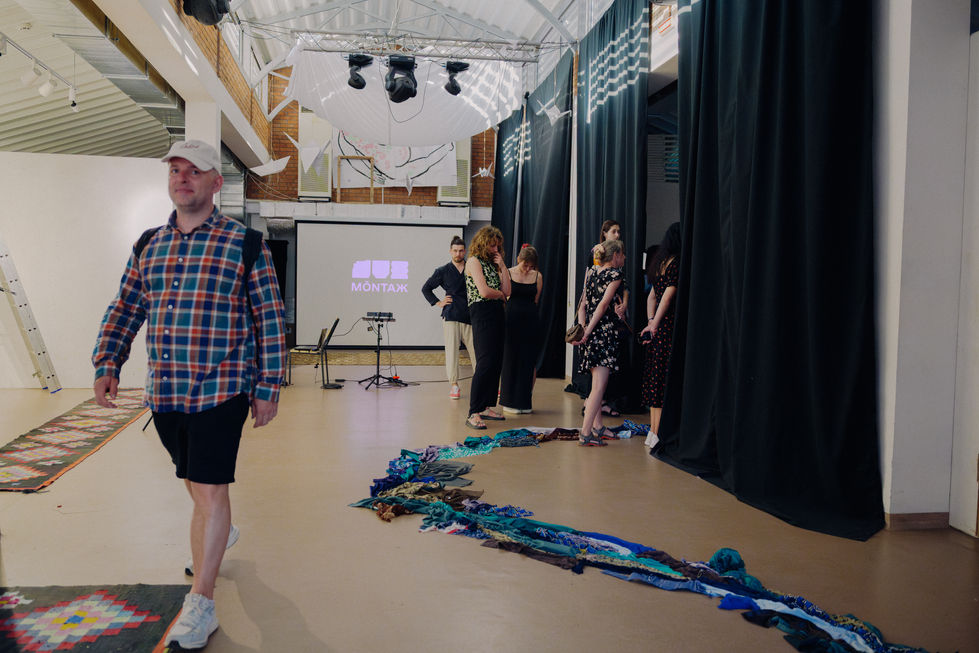 Detail showing material textures that evoke water flow, erosion, and the memory of a river hidden beneath the city surface.